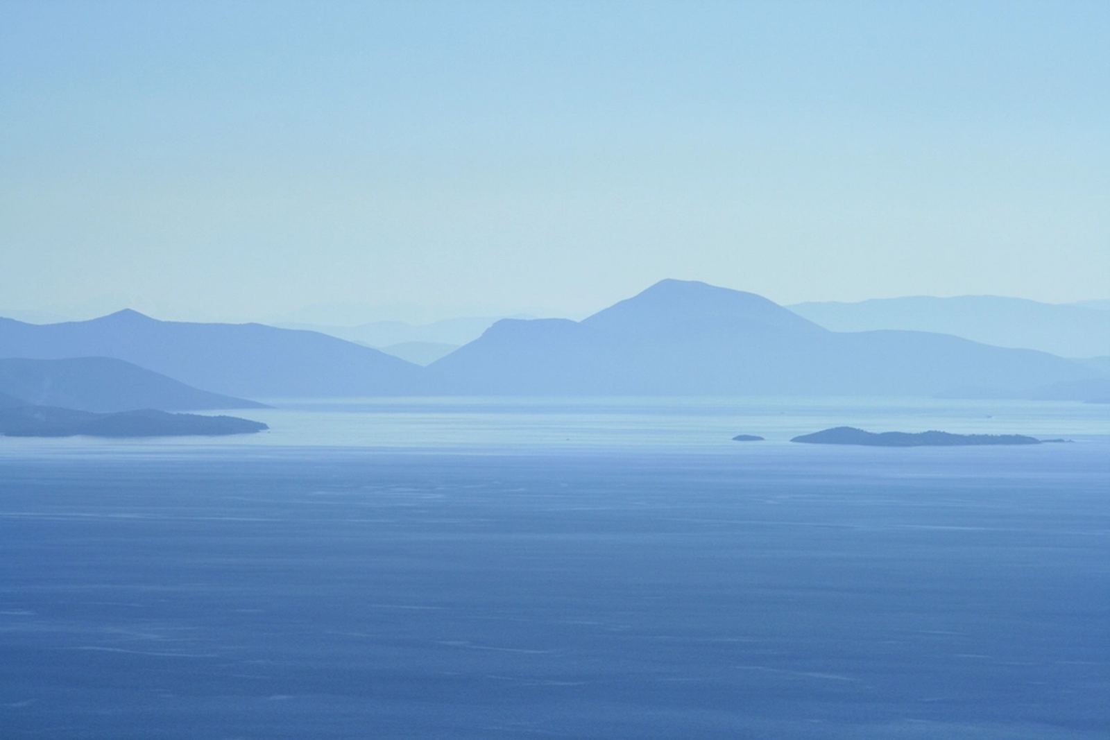 Layered blue headlands fading into calm water on Vancouver Island